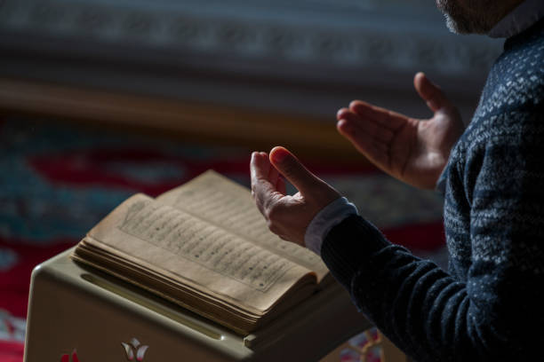 Image of a man praying with faith.