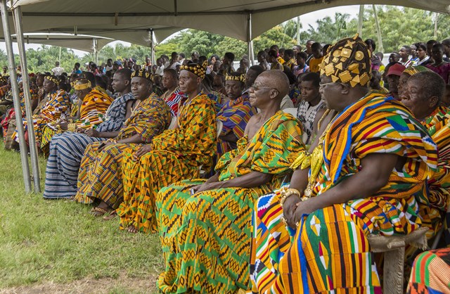 African elders wear Kente fabrics during a cultural event.