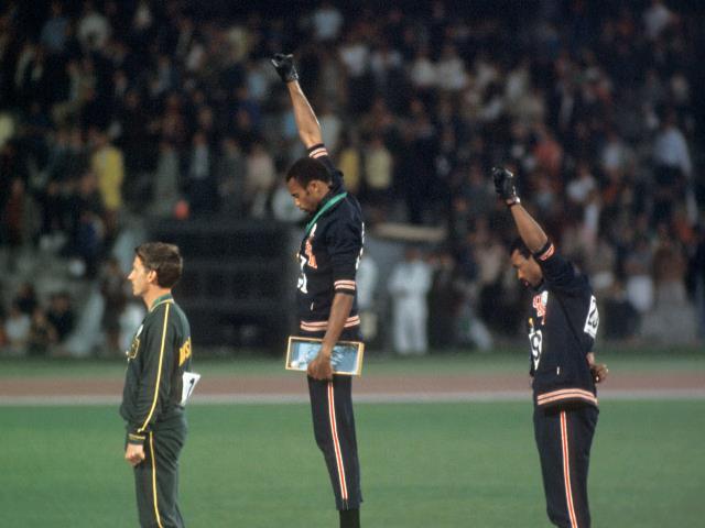 Tommie Smith and John Carlos perform the Black Power symbol at the 1968 Mexico City Olympics. Credit: Getty Images.