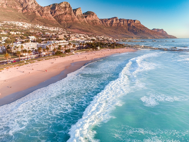 Camps Bay Beach has several activities and a wonderful landscape displaying intricately-carved mountains.